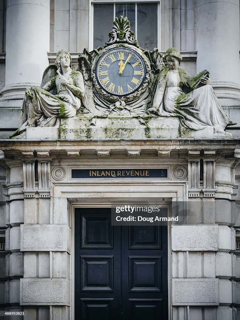 Inland Revenue sign and old clock