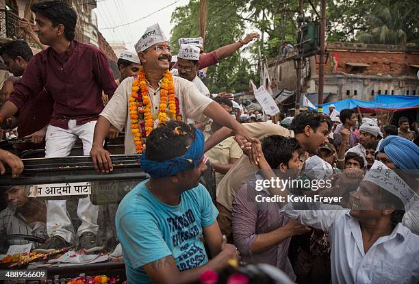 Leader Arvind Kejriwal is greeted by supporters during a rally by the leader on May 9, 2014 in Varanasi, India. India is in the midst of a nine-phase...