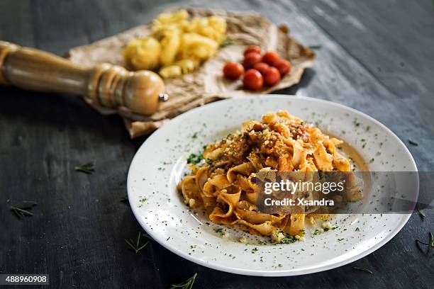 homemade pasta - tomato pasta stock pictures, royalty-free photos & images