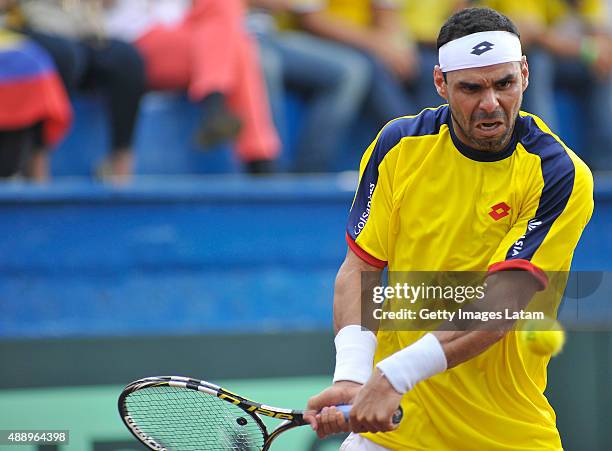 Alejandro Falla of Colombia returns a backhand shot during the Davis Cup World Group Play-off singles match between Alejandro Falla of Colombia and...