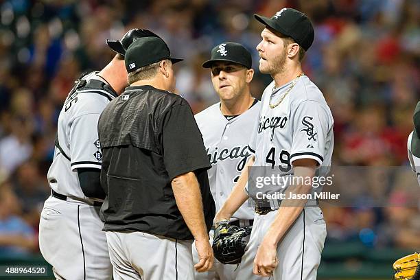 Pitching coach Don Cooper talks with starting pitcher Chris Sale of the Chicago White Sox during the third inning against the Cleveland Indians at...