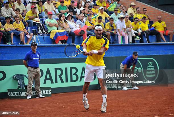 Alejandro Falla of Colombia returns a backhand shot during the Davis Cup World Group Play-off singles match between Alejandro Falla of Colombia and...