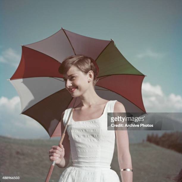 Belgian-born actress Audrey Hepburn on a golf course at the Bürgenstock resort, Switzerland, 1954.