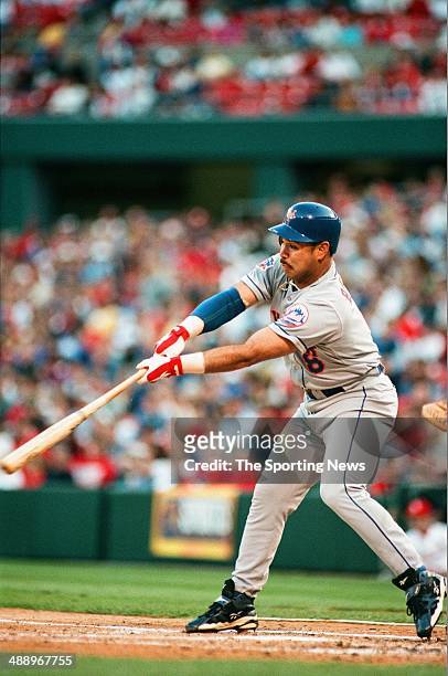 Carlos Baerga of the New York Mets bats against the St. Louis Cardinals at Busch Stadium on May 9, 1997 in St. Louis, Missouri. The Mets beat the...
