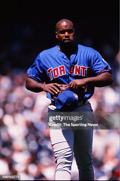 Carlos Delgado of the Toronto Blue Jays looks on against the New York Yankees at Yankee Stadium on April 30, 2000 in the Bronx borough of New York...