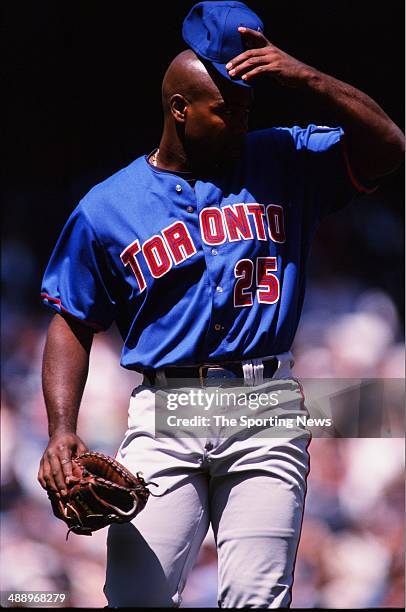 Carlos Delgado of the Toronto Blue Jays looks on against the New York Yankees at Yankee Stadium on April 30, 2000 in the Bronx borough of New York...