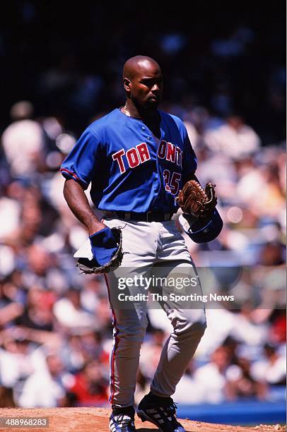 Carlos Delgado of the Toronto Blue Jays looks on against the New York Yankees at Yankee Stadium on April 30, 2000 in the Bronx borough of New York...