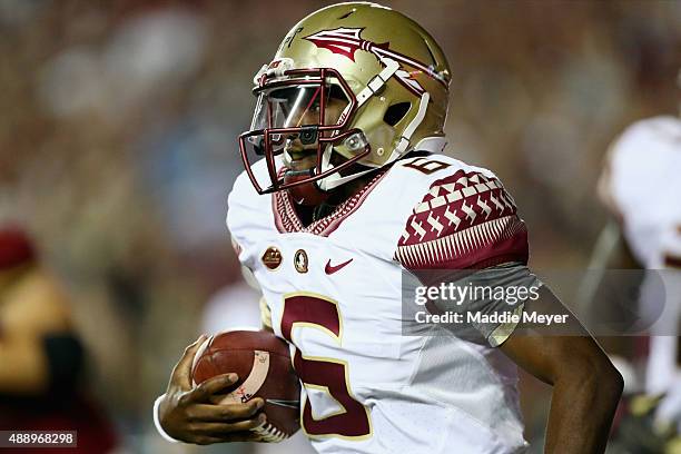 Everett Golson of the Florida State Seminoles carries the ball during the second quarter against the Boston College Eagles at Alumni Stadium on...