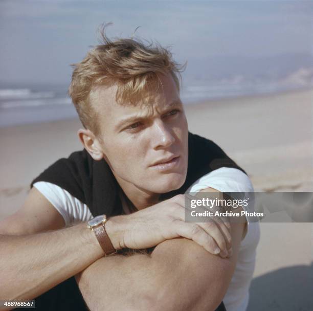 American actor Tab Hunter on a beach, circa 1955.