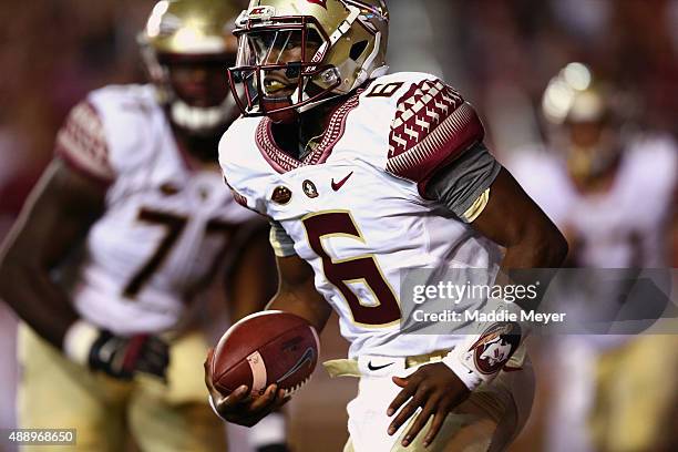 Everett Golson of the Florida State Seminoles carries the ball during the second quarter against the Boston College Eagles at Alumni Stadium on...