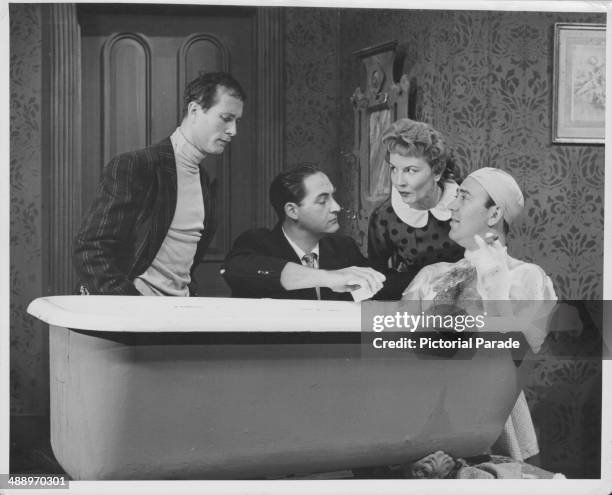 Actors Howard Morris, Sid Caesar, Janet Blair and Carl Reiner, in a sketch from the television show 'Your Show of Shows', circa 1950-1954.