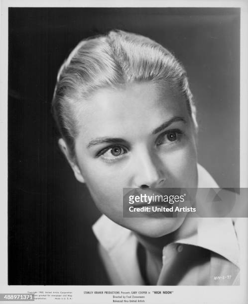 Promotional headshot of actress Grace Kelly, as she appears in the movie 'High Noon', 1952.