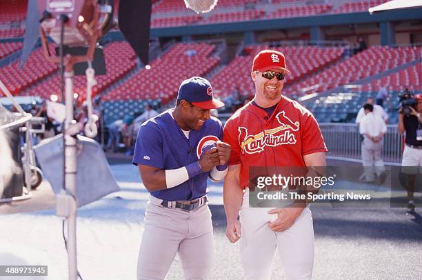 Mark McGwire of the St. Louis Cardinals and Sammy Sosa of the Chicago Cubs joke before the game at Busch Stadium on September 7, 1998 in St. Louis,...