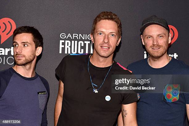 Musicians Guy Berryman, Chris Martin and Jonny Buckland of Coldplay attend the 2015 iHeartRadio Music Festival at MGM Grand Garden Arena on September...