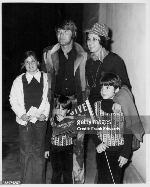 Singer Glen Campbell with his children Kelli, Travis and Kane, attending a charity basket ball game in Beverley Hill, California, February 3rd 1973.