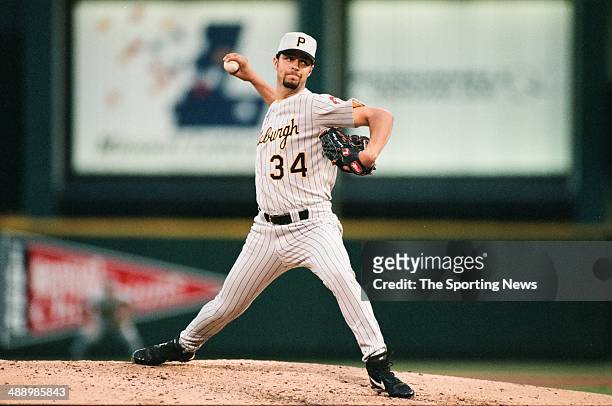 Esteban Loaiza of the Pittsburgh Pirates pitches against the St. Louis Cardinals at Busch Stadium on July 3, 1997 in St. Louis, Missouri. The Pirates...