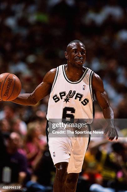 Avery Johnson of the San Antonio Spurs brings the ball upcourt during the game against the Dallas Mavericks in Game One of the Western Conference...