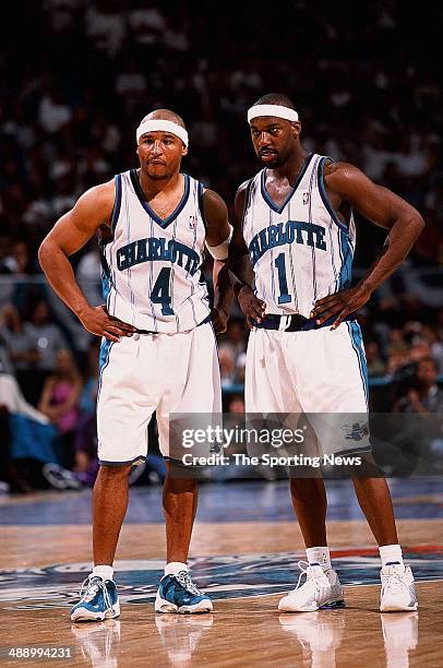 David Wesley and Baron Davis of the Charlotte Hornets stand together on the court in Game Six against the Eastern Conference Semifinals of the...