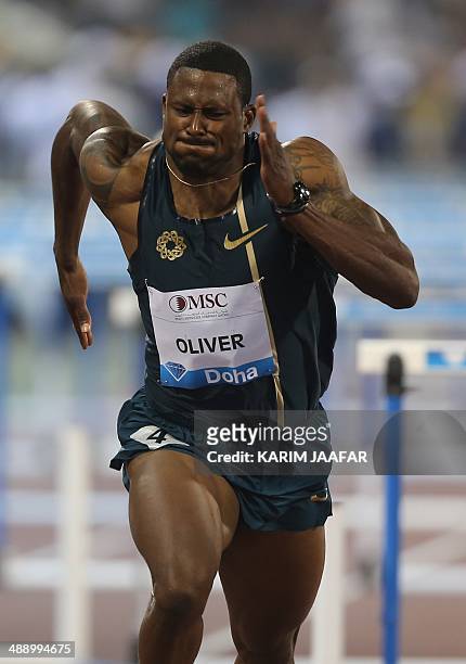 David Oliver of the USA runs to win the 110m hurdles at the IAAF Diamond League in the Qatari capital Doha on May 9, 2014. AFP PHOTO / AL-WATAN DOHA...