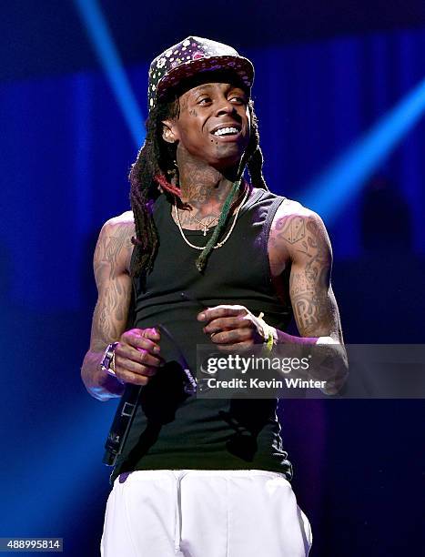 Rapper Lil Wayne performs onstage at the 2015 iHeartRadio Music Festival at MGM Grand Garden Arena on September 18, 2015 in Las Vegas, Nevada.