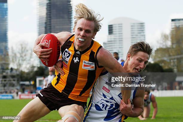 Eli Templeton of Sandringham tackles Will Langford of Box Hill during the VFL Preliminary Final match between Box Hill Hawks and Sandringham at North...