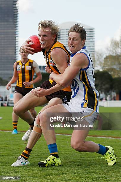 Eli Templeton of Sandringham tackles Will Langford of Box Hill during the VFL Preliminary Final match between Box Hill Hawks and Sandringham at North...