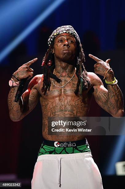 Rapper Lil Wayne performs onstage at the 2015 iHeartRadio Music Festival at MGM Grand Garden Arena on September 18, 2015 in Las Vegas, Nevada.