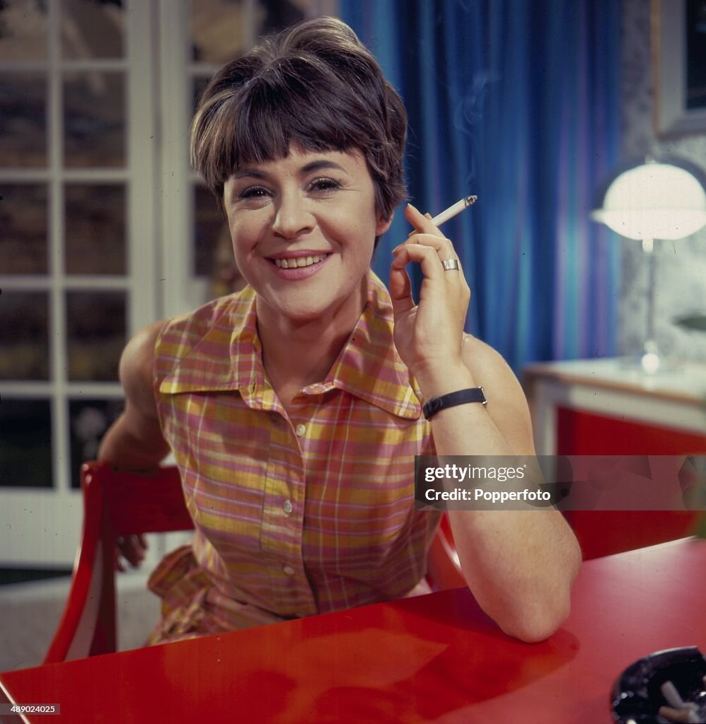 English Actress Dilys Laye Posed Smoking A Cigarette On The Set Of english-actress-dilys-laye-posed-smoking-a-cigarette-on-the-set-of