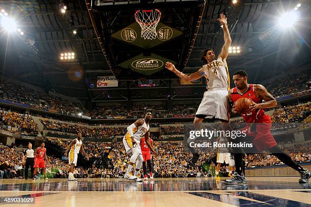 Mike Scott of the Atlanta Hawks drives against Luis Scola of the Indiana Pacers in Game Five of the East Conference Quarter Finals of the 2014 NBA...