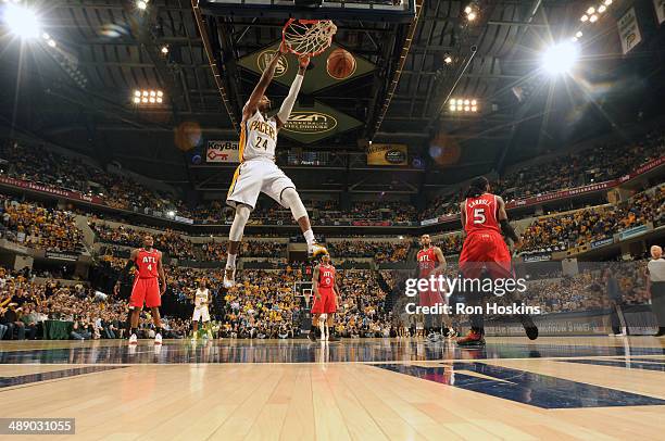 Paul George of the Indiana Pacers dunks against the Atlanta Hawks in Game Five of the East Conference Quarter Finals of the 2014 NBA playoffs at...
