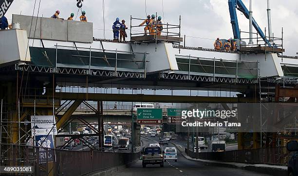 Work continues on a bridge for the Transcarioca BRT highway being constructed on May 9, 2014 in Rio de Janeiro, Brazil. The Transcarioca is part of...