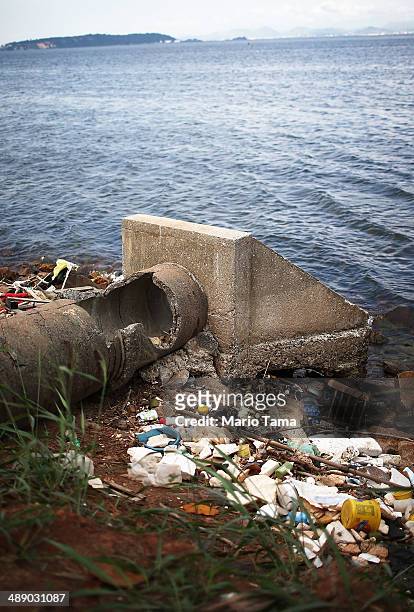 An abandoned drainage pipe sits on the edge of polluted Guanabara Bay, on May 9, 2014 in Rio de Janeiro, Brazil. The city is taking on a number of...