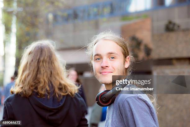 portrait of nineteen years old teenage boy with headphones, outdoor - 18 19 years stock pictures, royalty-free photos & images