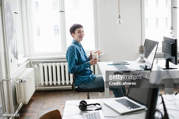 candid portrait of a young women working - founder stock pictures, royalty-free photos & images