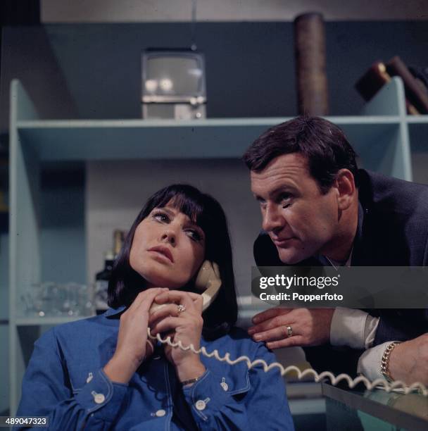 British actor Edward Judd pictured with actress Caroline Mortimer in a scene from the television series 'Intrigue' in 1967.