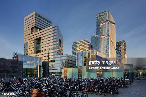 Bicycle parking lot and modern business buildings, Amsterdam Zuidas district, Amsterdam, the Netherlands.