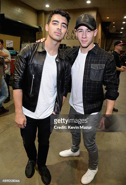 Singers Joe Jonas and Nick Jonas attends the 2015 iHeartRadio Music Festival at MGM Grand Garden Arena on September 18, 2015 in Las Vegas, Nevada.