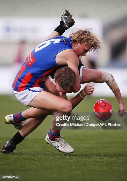 Campbell Lane of the Chargers tackles Luke McLeod of the Rebels during the TAC Cup Semi Final match between North Ballarat and Oakleigh Chargers at...