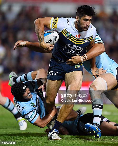 James Tamou of the Cowboys makes a break during the Second NRL Semi Final match between the North Queensland Cowboys and the Cronulla Sharks at...