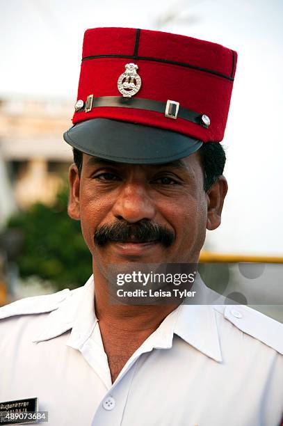 Police officer in Pondicherry wearing a red kepi, a leftover from the time the town was a French colony.