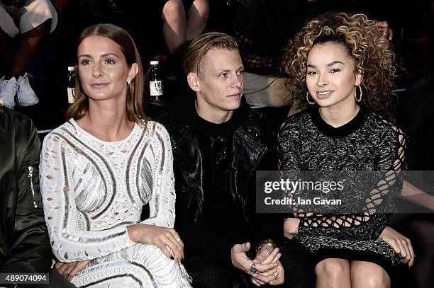 Millie Mackintosh, Lewi Morgan and singer Ella Eyre attend the Julien Macdonald show during London Fashion Week SS16 on September 19, 2015 in London,...