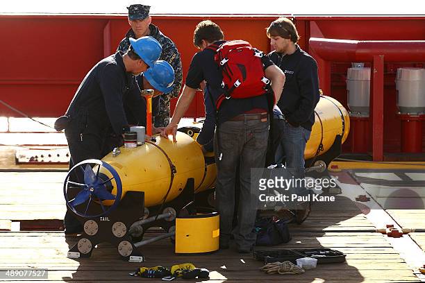 Technicians work on the Bluefin-21 autonomous underwater vehicle as Captain Mark Matthews of the US Navy look on prior to the ADV Ocean Shield...