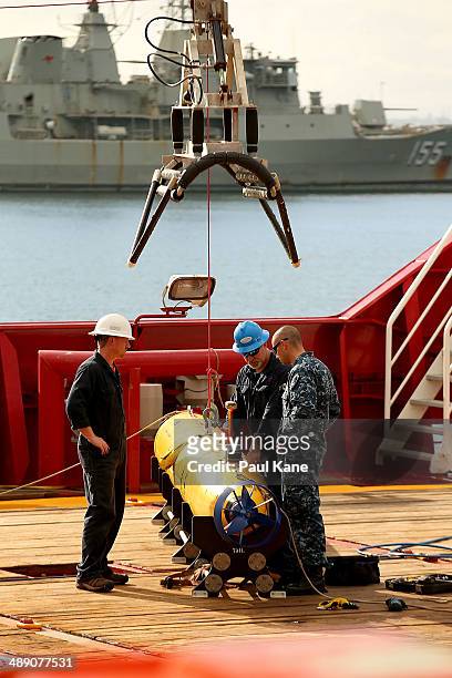 Technicians work on the Bluefin-21 autonomous underwater vehicle prior to the ADV Ocean Shield slipping from the wharf at HMAS Stirling on May 10,...