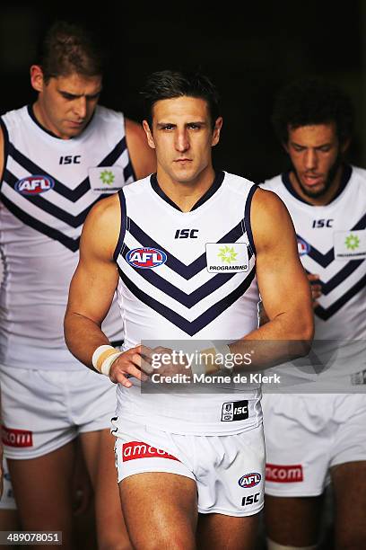 Matthew Pavlich of the Dockers leads his team onto the field during the round eight AFL match between the Port Adelaide Power and Fremantle Dockers...