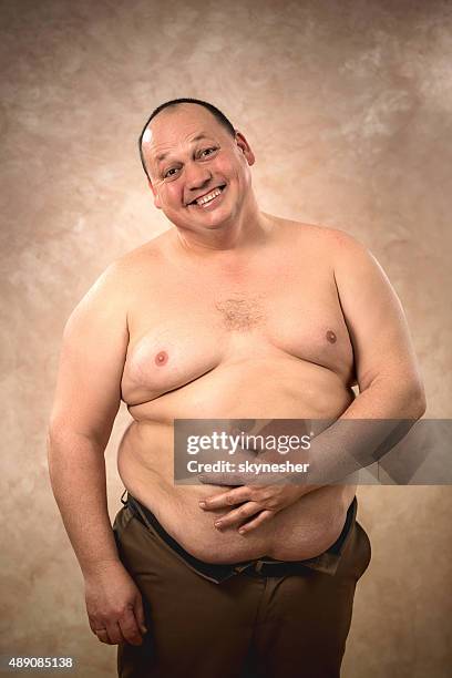 portrait of cheerful shirtless fat man looking at camera. - fat guy belly stock pictures, royalty-free photos & images