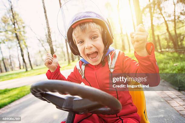 little racer winning - boy playing with cars stock pictures, royalty-free photos & images