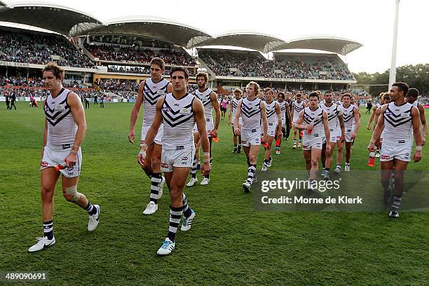 Dockers players leave the field lead by their captain Matthew Pavlich after the round eight AFL match between the Port Adelaide Power and Fremantle...