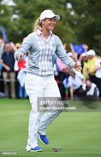 Suzann Pettersen of team Europe celebrates winning her match during the morning foursomes matches at The Solheim Cup at St Leon-Rot Golf Club on...
