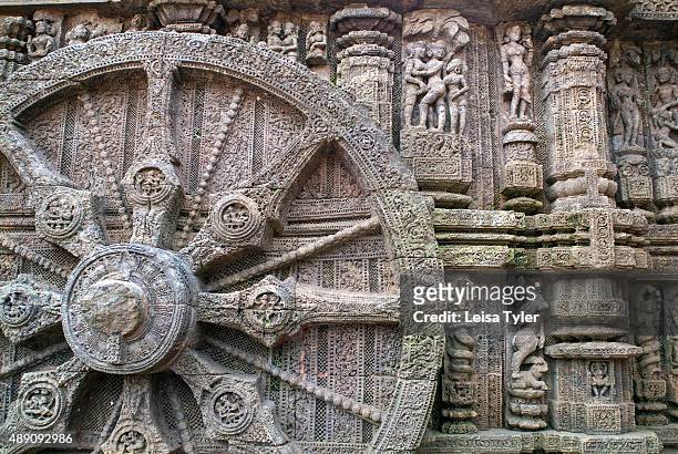 Carved stone wheel at the mid-13th century Sun Temple in Konark, India, built in the shape of a chariot for the sun god Surya.
