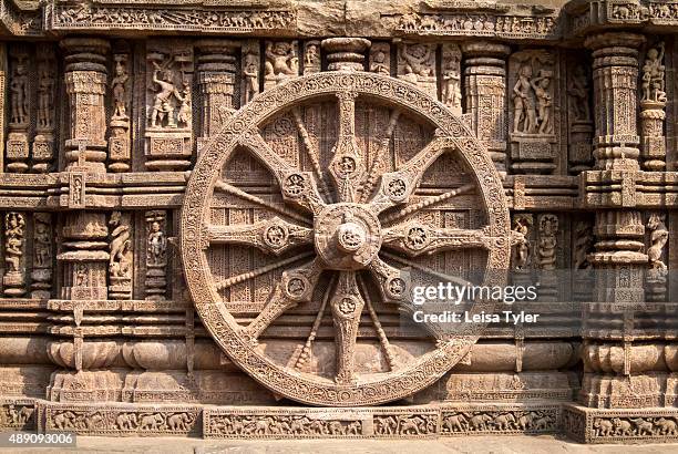 Carved stone wheel at the mid-13th century Sun Temple in Konark, India, built in the shape of a chariot for the sun god Surya.